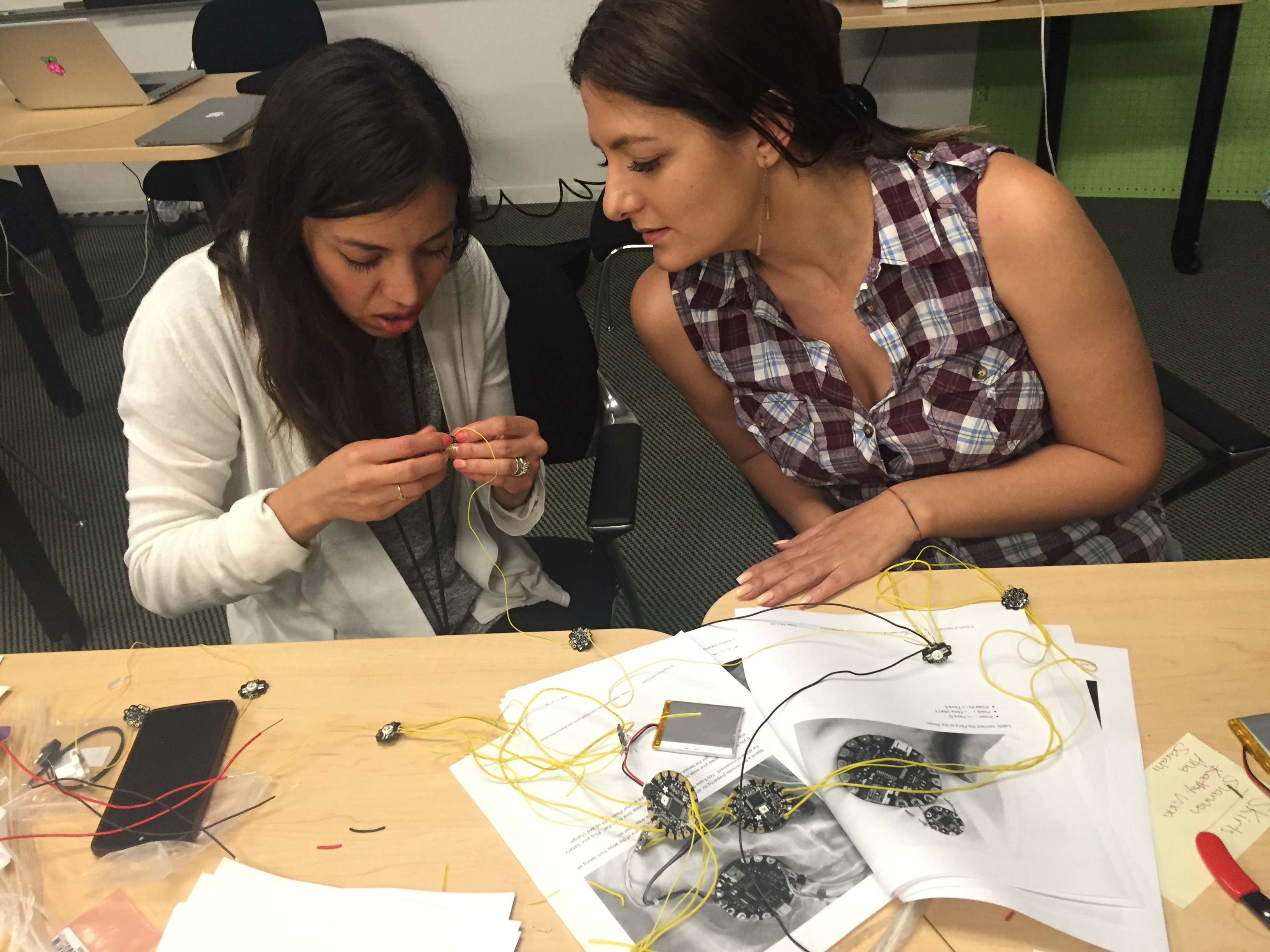Sarahi Mireles (@sarahimireles) and Ana Tomescu (@annatomescu) work on that fiber-optic pixie skirt.
